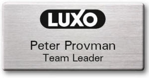 Flat 31-5100-04-20 70x34 Silver foil on black badge - Engraved lines in black