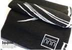 Terry Towel - Produced in jacquard weaving with logo all over the towel. Yarn Dyed, Black and White color